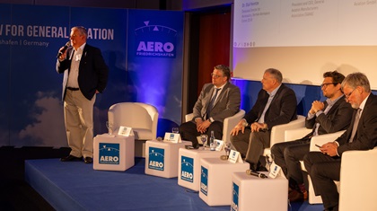 The opening press conference at Aero Friedrichshafen 2024 in Germany was moderated by Tobias Bretzel, show director, and included (left to right) Olaf Heintze, division director for aeronautics of the German Aerospace Center (DLR); Pete Bunce, president and CEO of the General Aviation Manufacturers Association; Deniz Weissenborn, founder and CEO of Platoon Aviation (GmbH); and Frank Liemandt, CEO of Der Deutsche Hubschrauber Verband. Photo by Stephen Yeates.